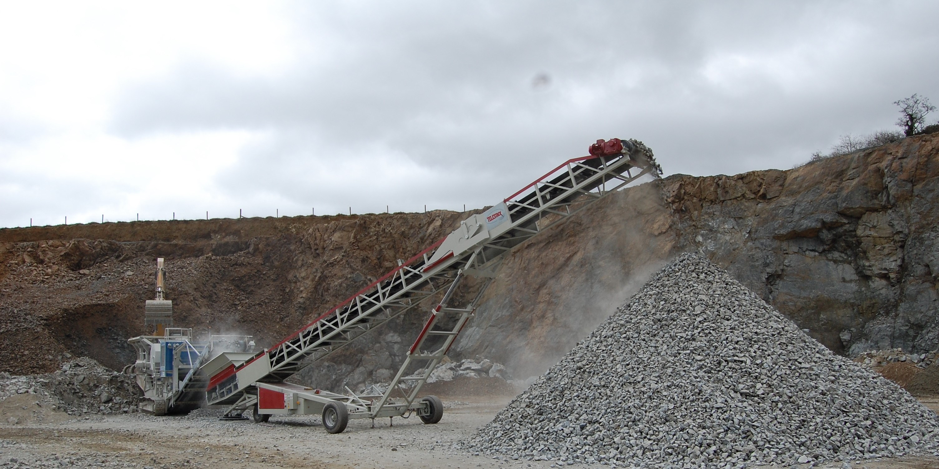 AggStack RS wheeled stacker stockpiling from mobile crusher_screen