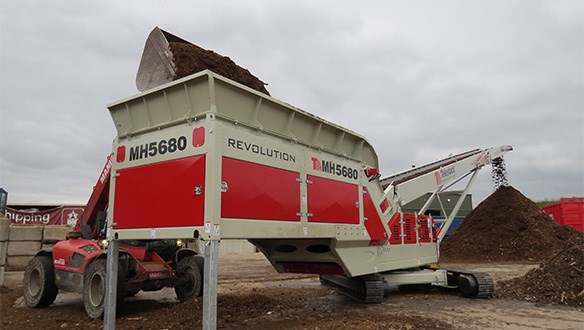 Mulch Hopper Stockpiling woodchips-mulch 