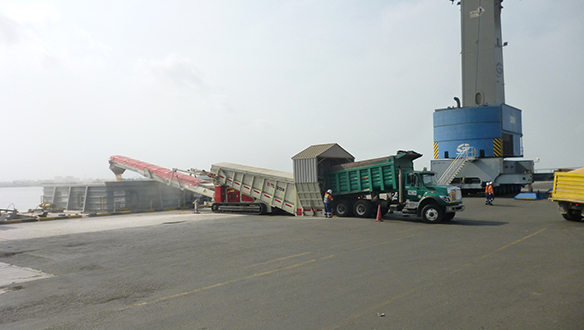 Truck Unloader loading grain to barge